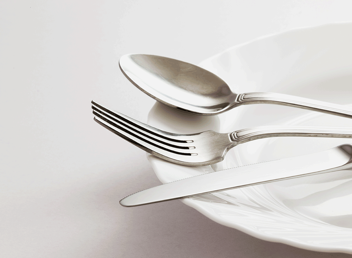 spoon for knife utensils on white glass plate