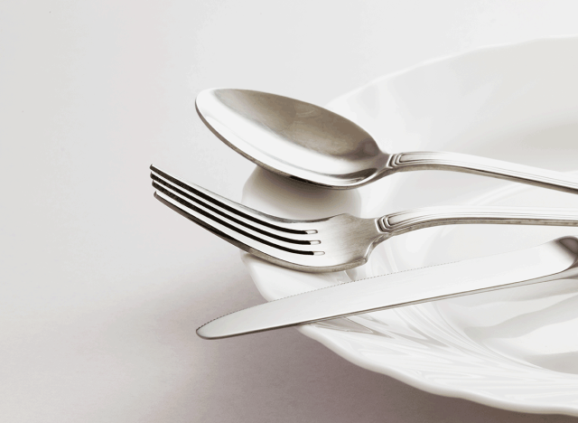 spoon for knife utensils on white glass plate