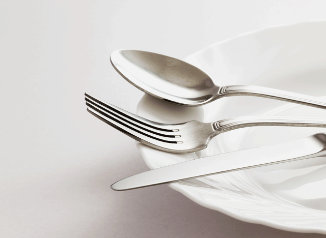 spoon for knife utensils on white glass plate