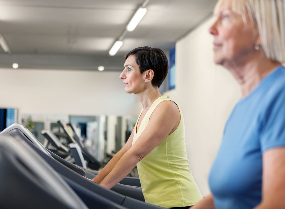 woman walking on treadmill unhappy