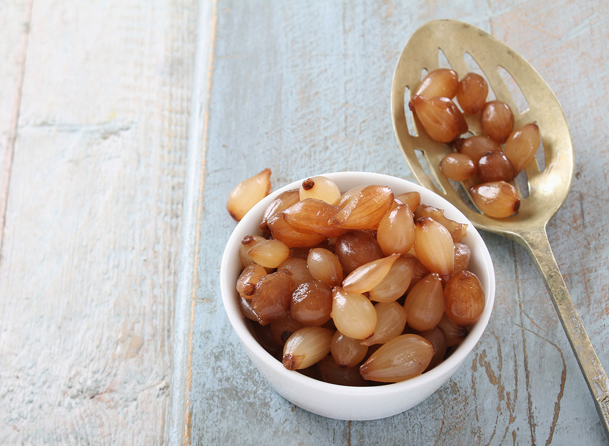 baby balsamic pearl onions in dish with spoon