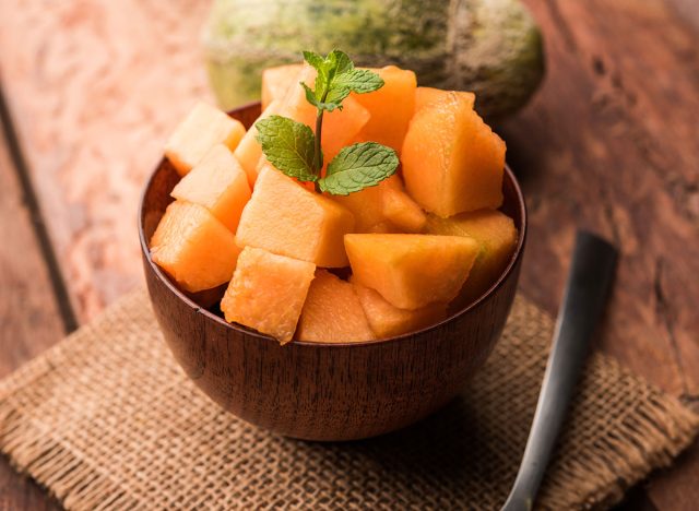 wooden bowl of sliced cantaloupe