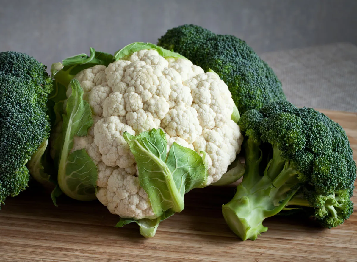 Cruciferous vegetables broccoli cauliflower on wooden cutting board - ovarian cancer diet