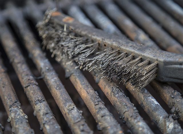 grill brush on dirty grill grates