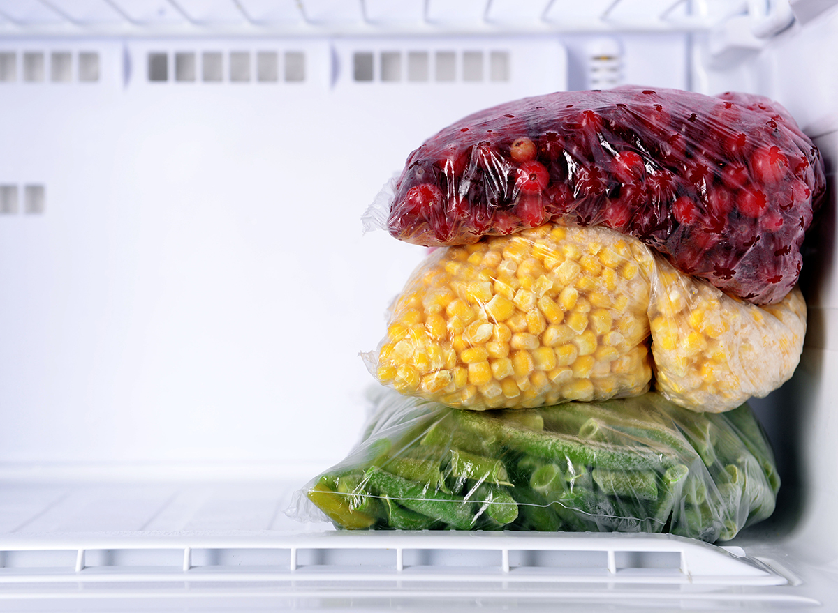 frozen cranberries corn and green beans in an empty freezer