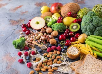 a spread of various vegetables, fruits, nuts and oats