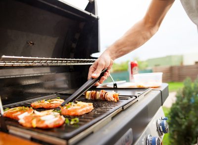 man grilling food outside