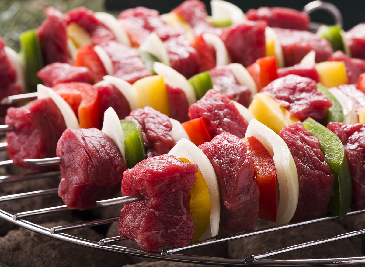 raw meat kebab close to vegetables