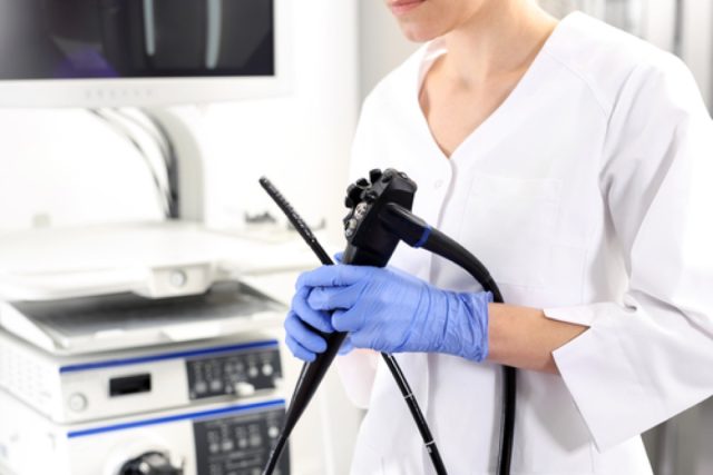 Gastroenterologist doctor with probe to perform gastroscopy and colonoscopy