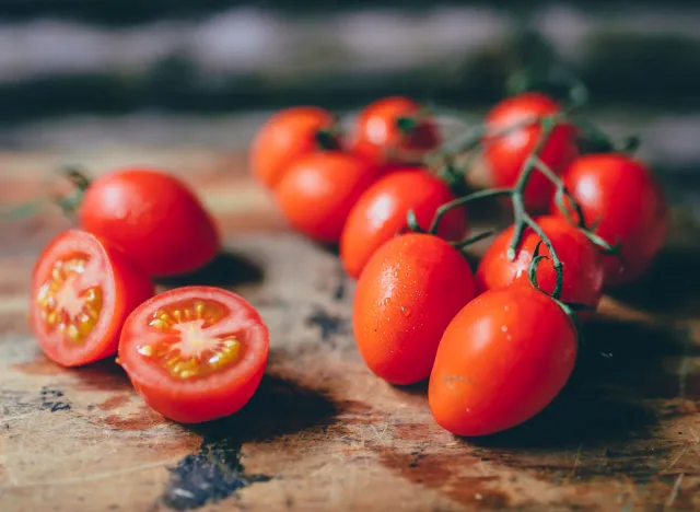 Cherry tomatoes on wooden cutting board