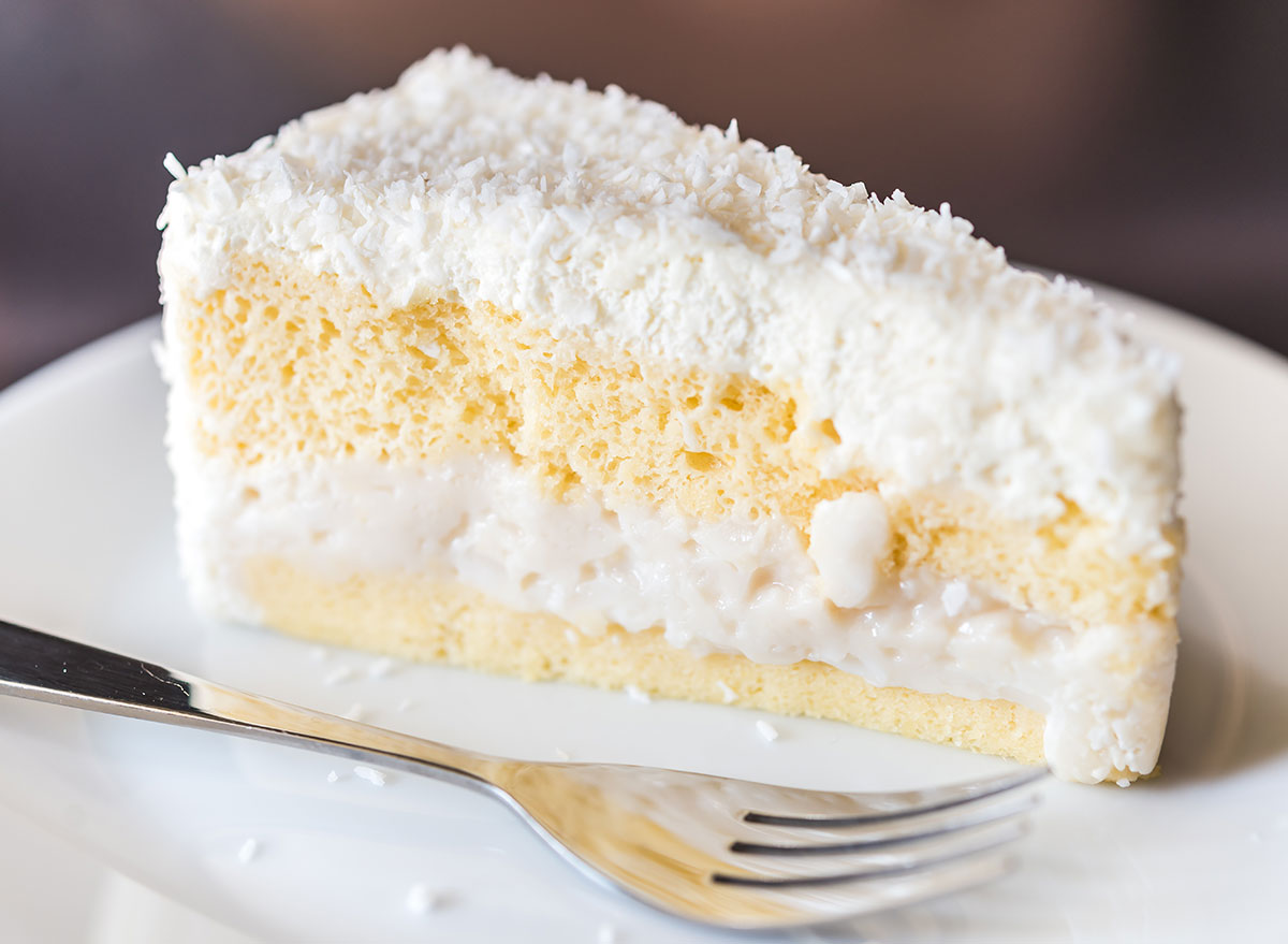 slice of coconut cake with fork