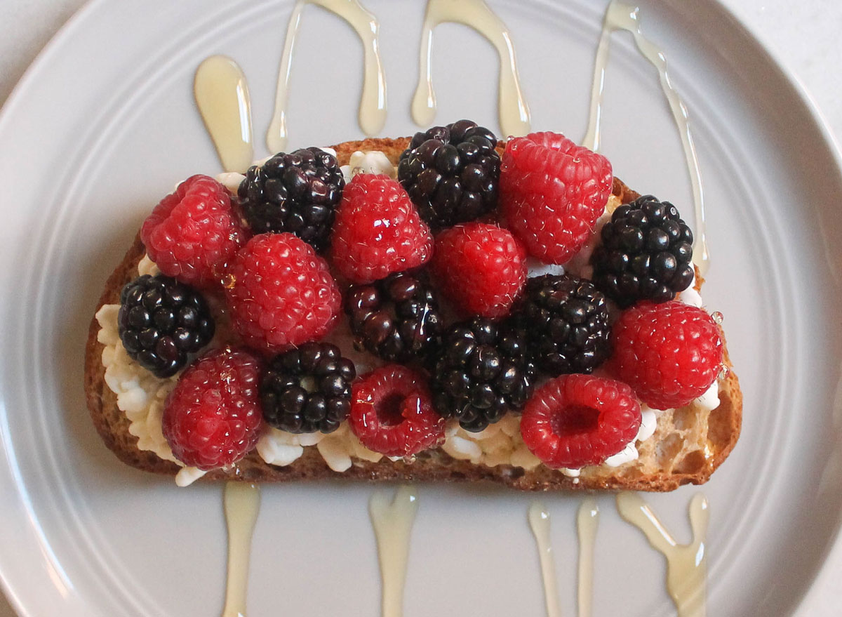 cottage cheese berries honey toast on grey plate