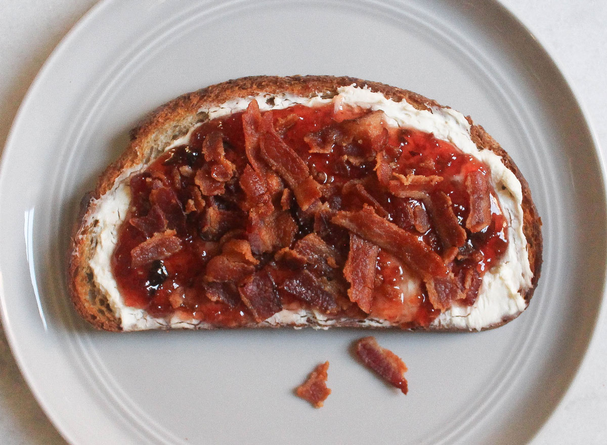 cream cheese hot pepper jam bacon toast on grey plate and marble counter