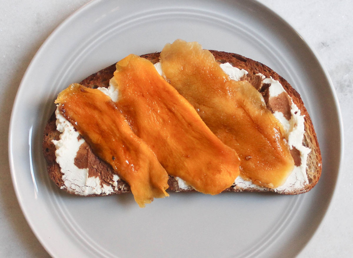 goat cheese balsamic mango toast on grey plate and marble counter