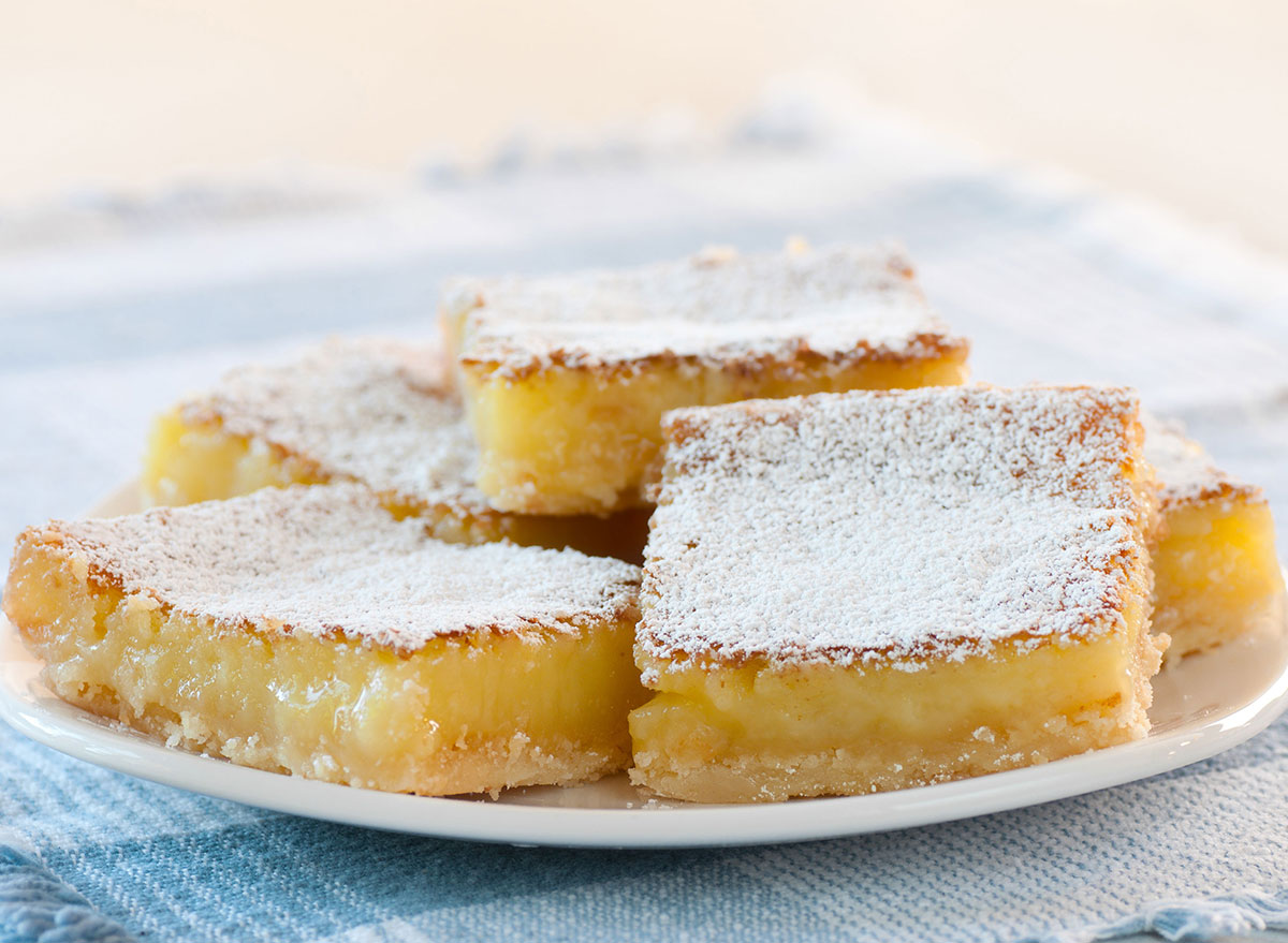lemon squares stacked on plate