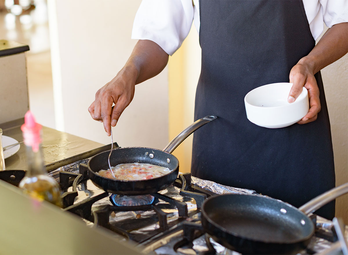 Man cooking eggs