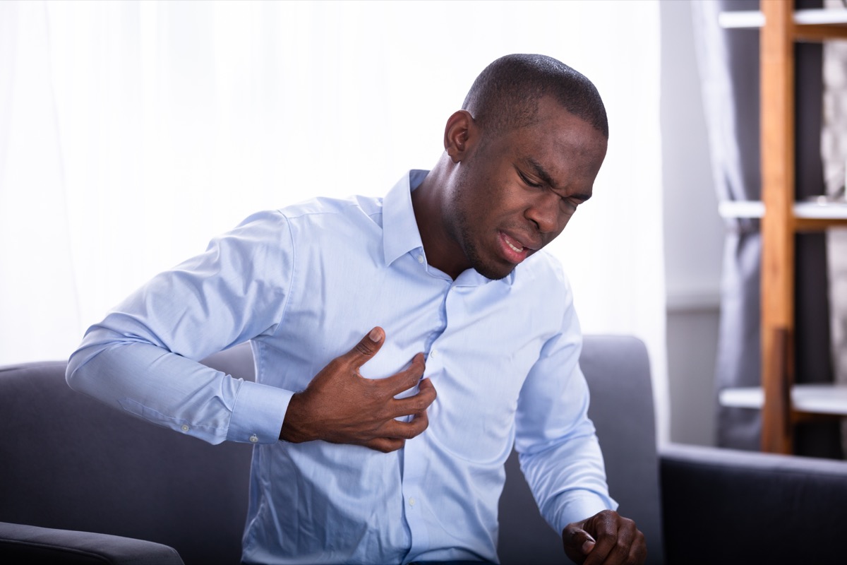 Portrait Of A Young African Man Suffering From Chest Pain