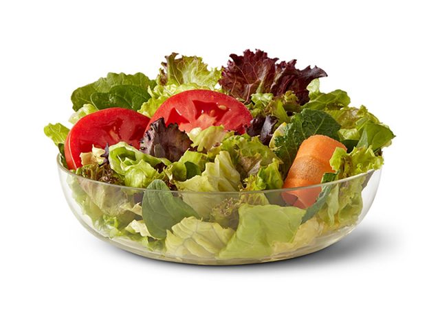 bowl of mcdonalds side salad on white background