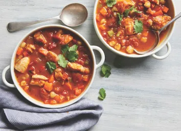 pumpkin chicken chili served in white pots