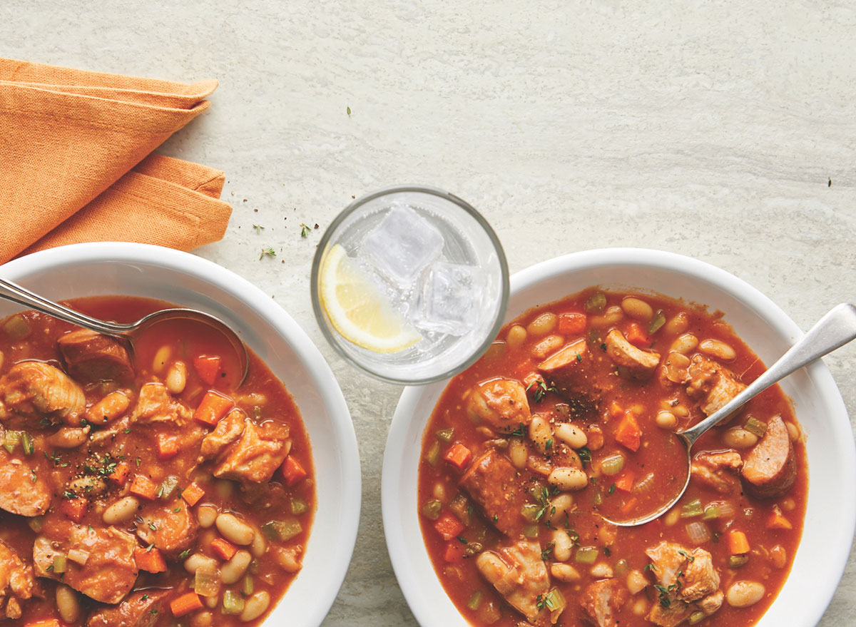 slow cooked turkey cassoulet in white bowls