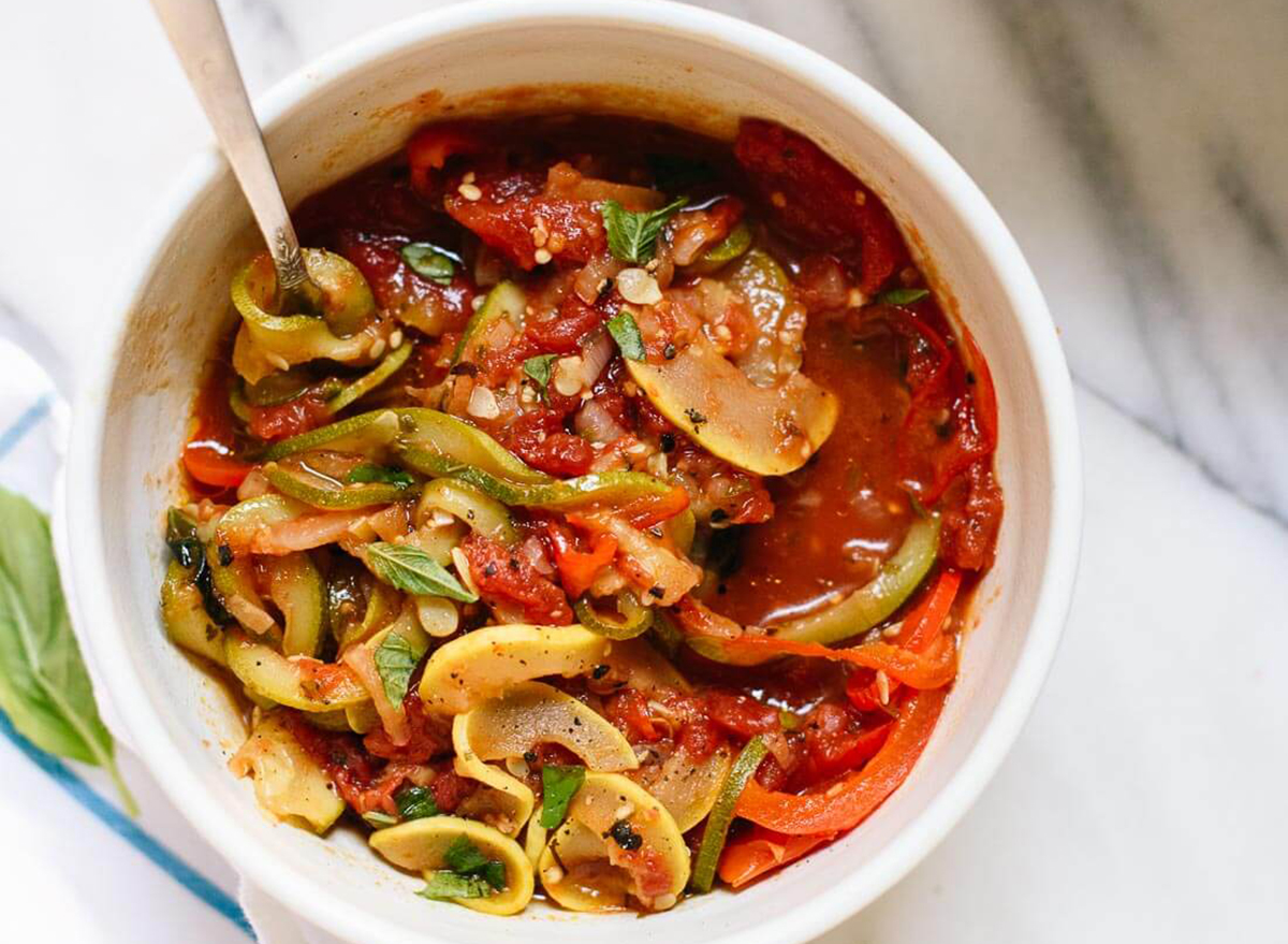 spiralized ratatouille in a bowl on a marble counter top