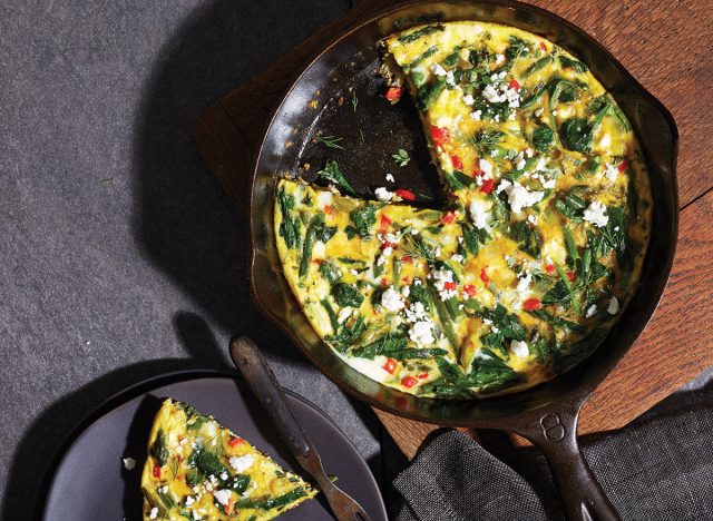 spring vegetable frittata in a black cast iron skillet