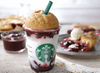 starbucks american cherry pie frappucino with domed pie crust and slice of cherry pie on a plate