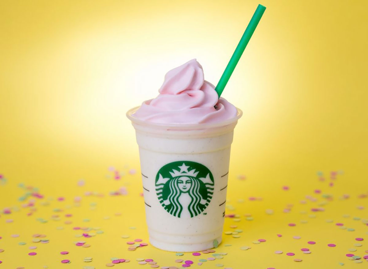 starbucks birthday cake frappuccino on yellow background with confetti