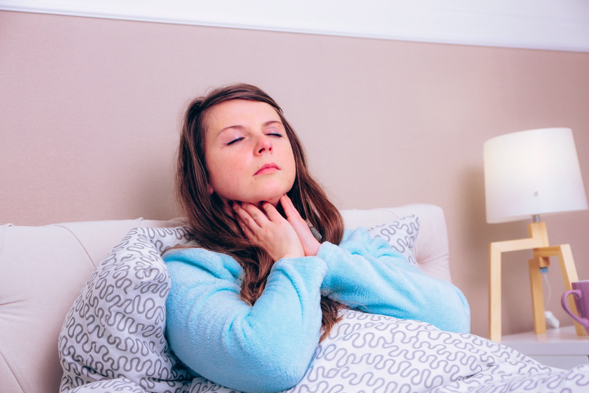 Young woman has strong sore throat