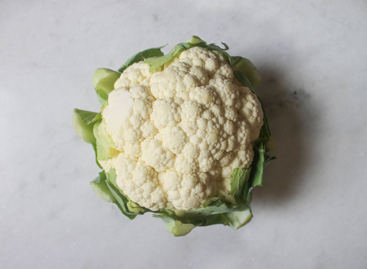 Head of cauliflower on a marble counter top