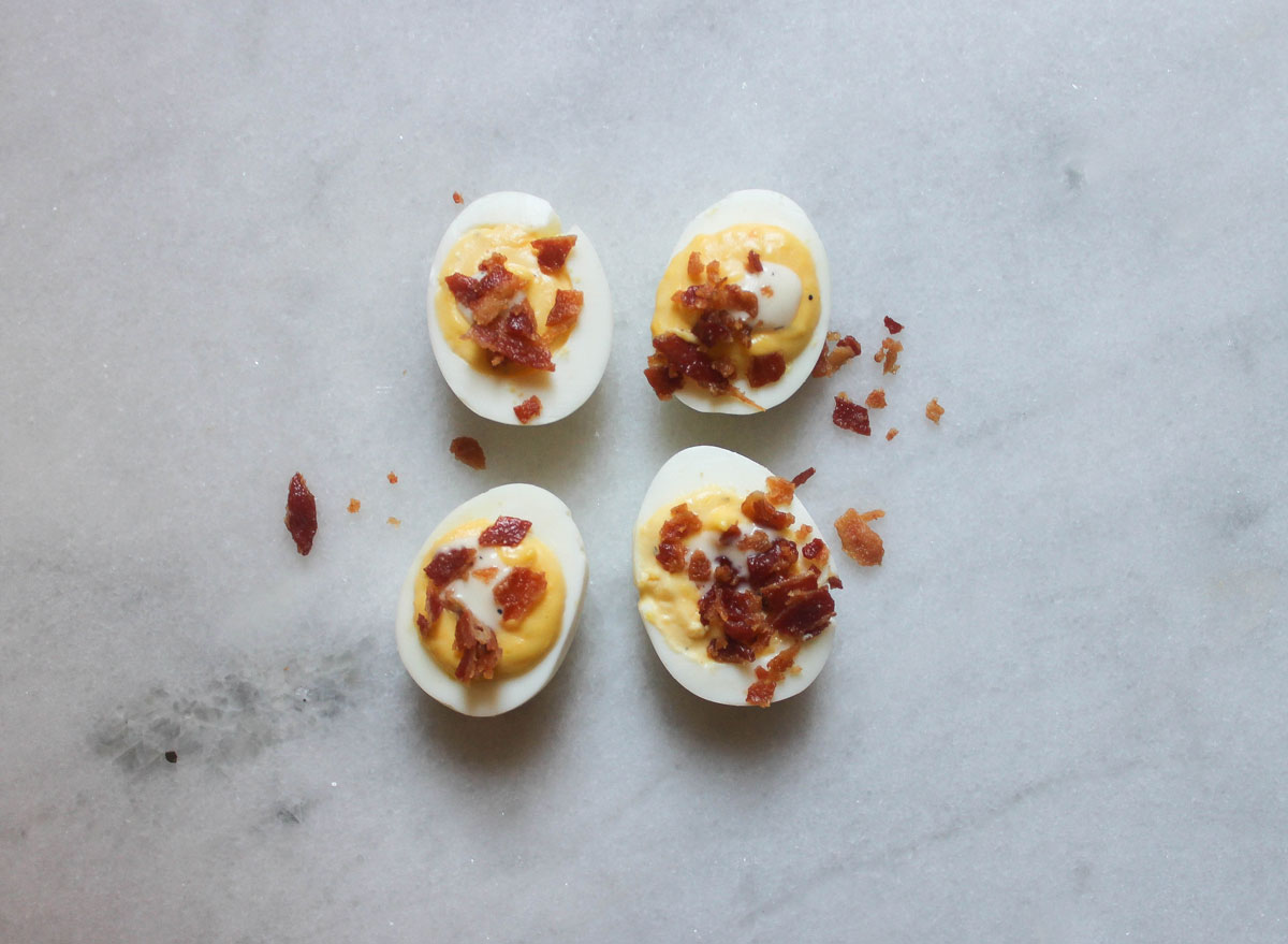 ranch bacon deviled eggs on a marble counter
