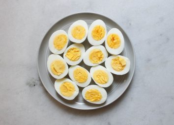 hard boiled eggs on a plate cut in half