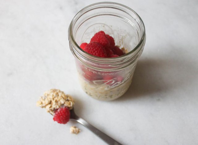 overnight oats finished with a spoon of oats on the marble counter