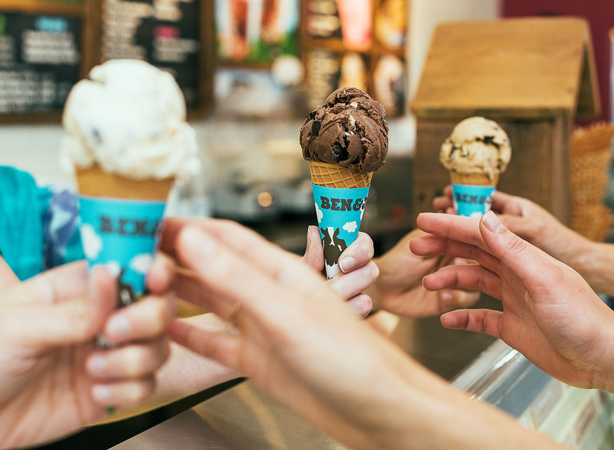 customers being handed ben and jerry's ice cream cones