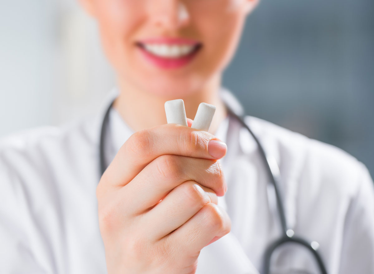 Doctor holding chewing gum for weight loss