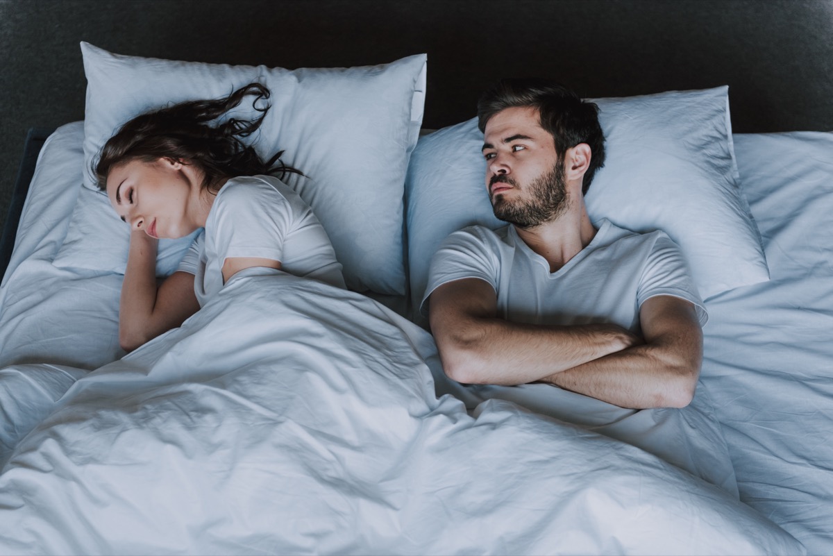 Young Attractive Couple Having Problem in Bed. Frustrated Man and Woman Not Talking Feeling Offended or Stubborn. Concept of Impotence. Man Have Problems.