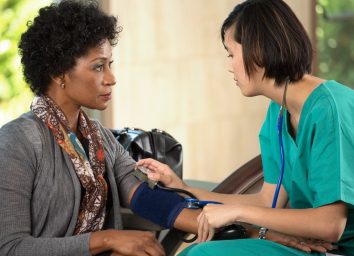 Nurse taking a patients blood pressure