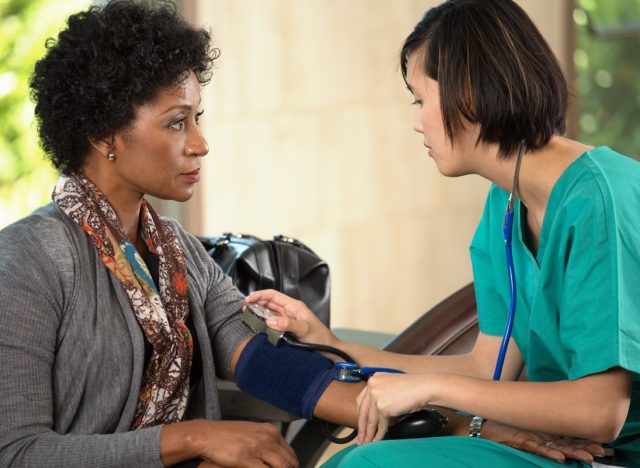 Nurse taking a patients blood pressure
