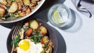 plate of italian hash with fried egg next to skillet and water glass
