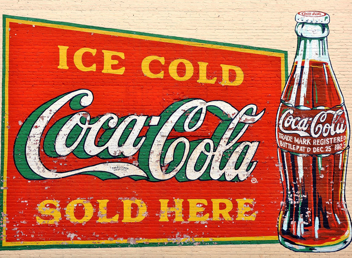 old painted coke logo wall