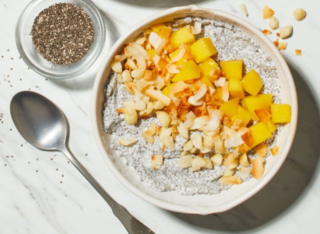 bowl of overnight chia pudding with chia seeds on marble countertop