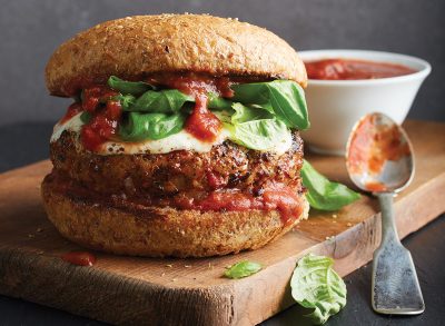 pizza burger on wooden tray with marinara sauce