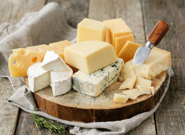 plate of many cheese on a cutting board