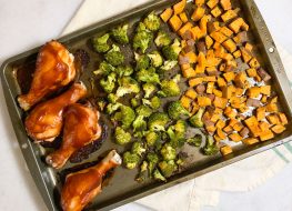 sheet pan bbq chicken dinner on a marble counter