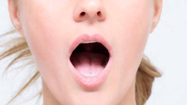 woman breathing with her mouth open