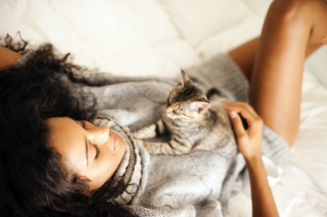 woman with cat indoors