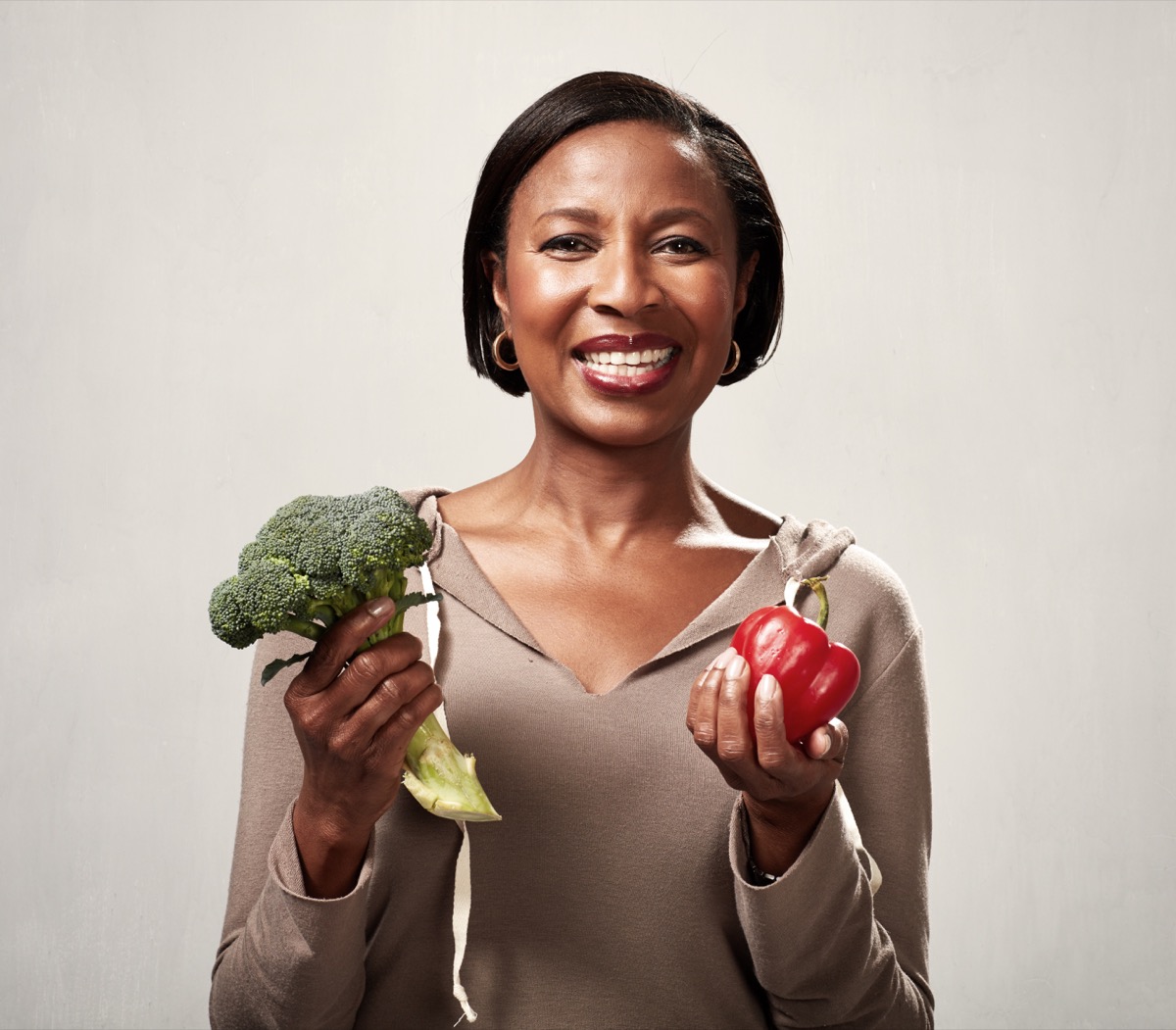 African american woman with broccoli