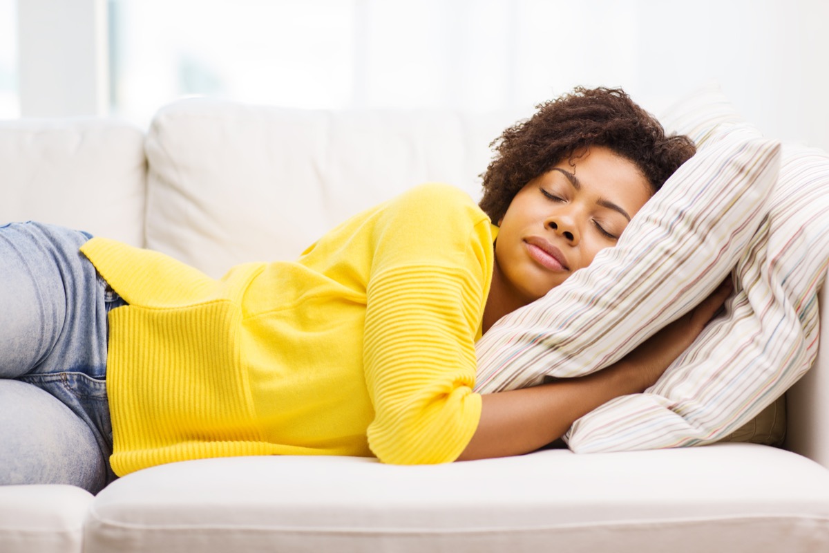 woman sleeping on sofa