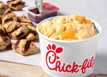 Chick fil a mac and cheese with grilled nuggets in background