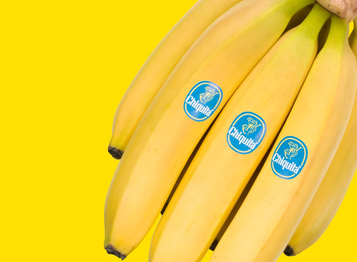 bunch of chiquita bananas on yellow background